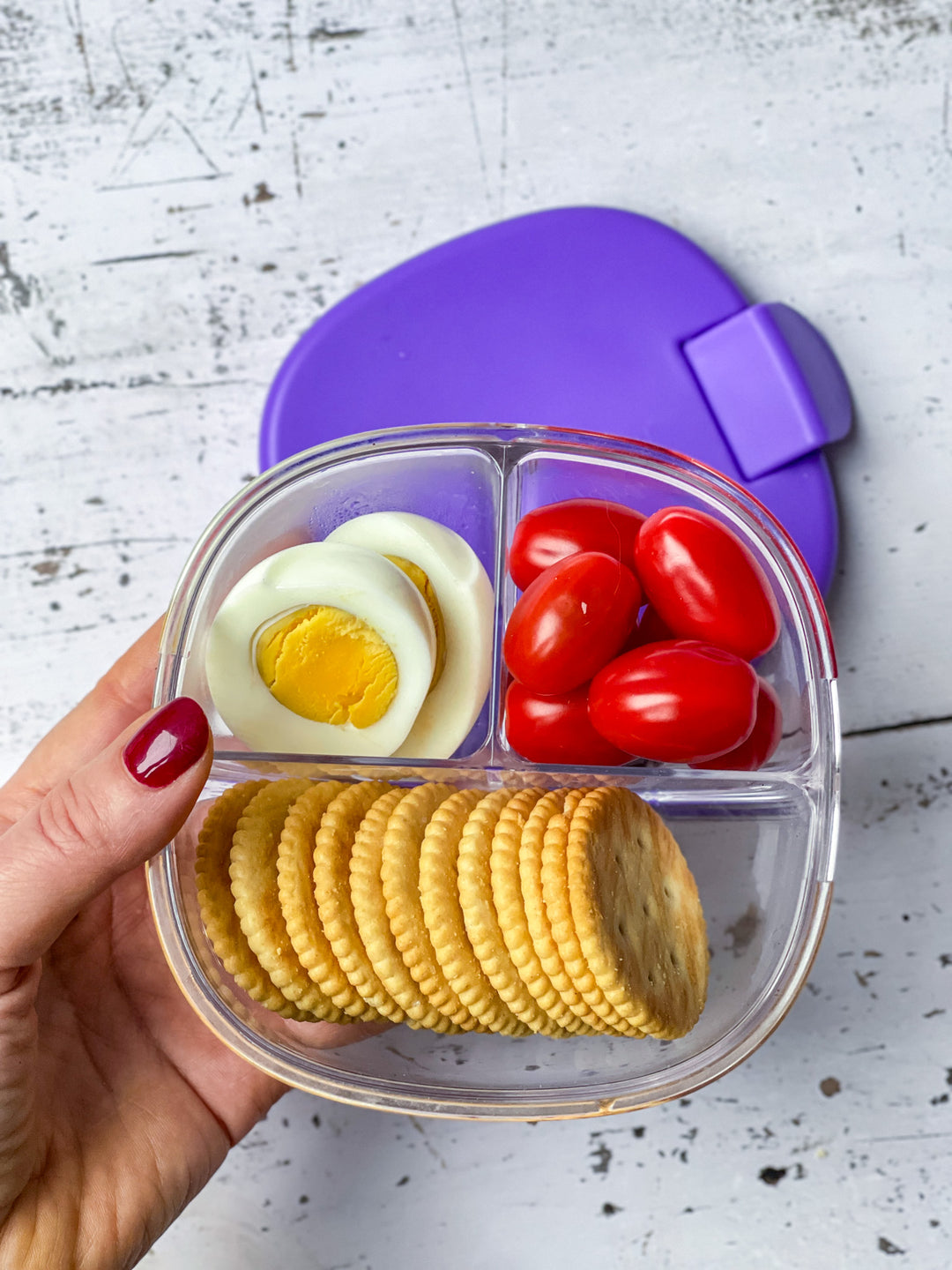 Yumbox Snack Bowl high protein snack with egg, tomatoes and crackers