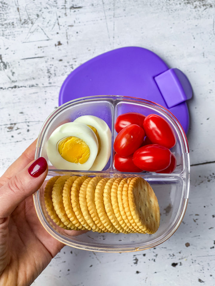 Yumbox Snack Bowl high protein snack with egg, tomatoes and crackers